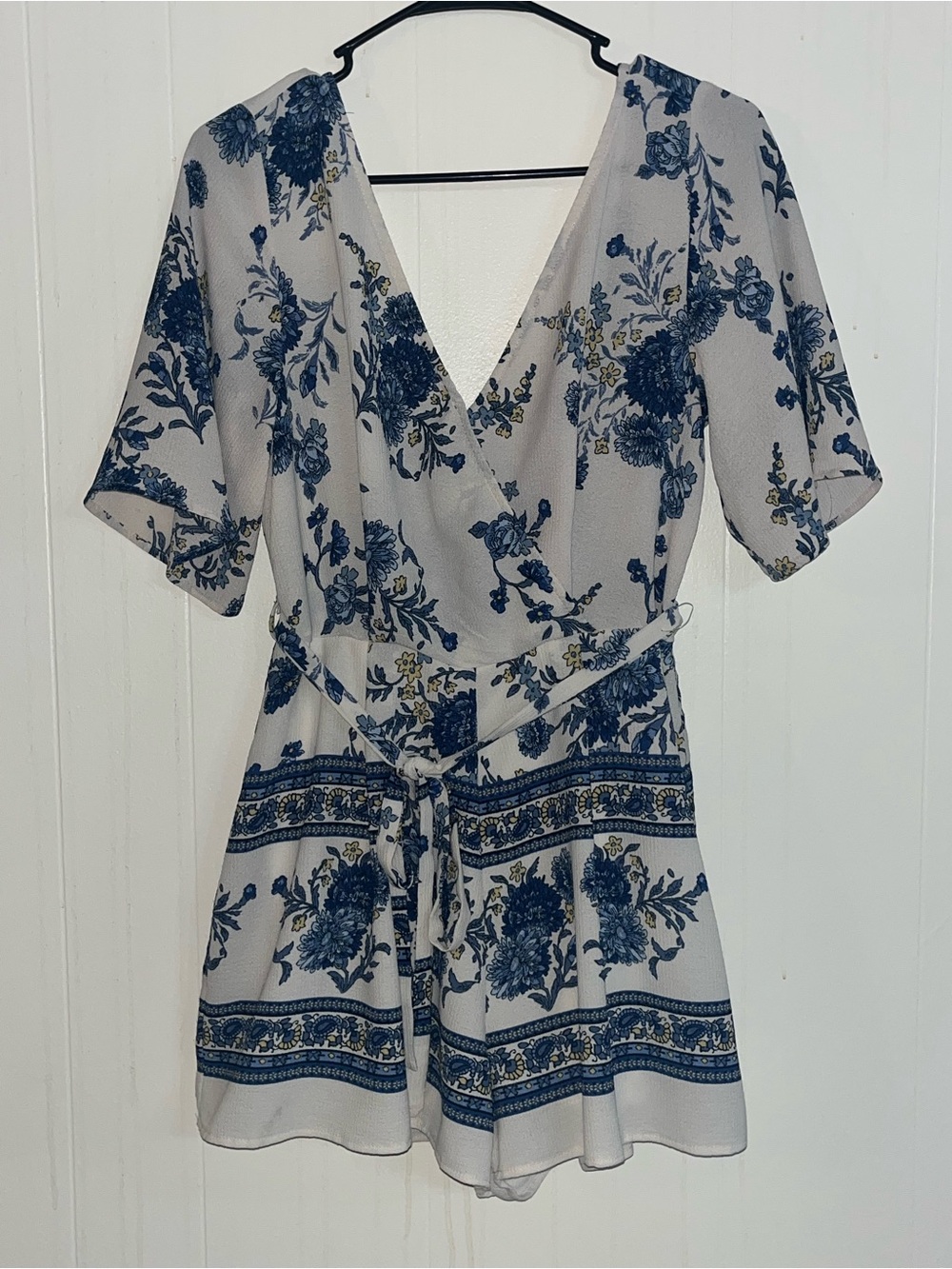 Cream with blue flower romper.